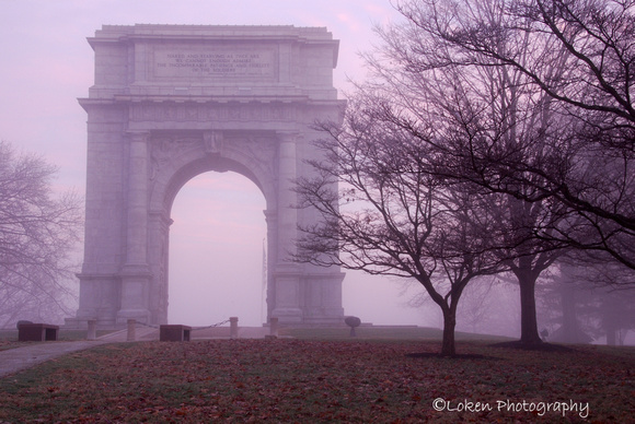 Arch through fog at dawn